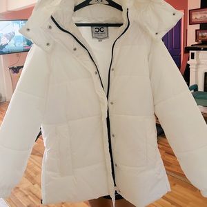 Culture couture white puffer jacket. Not heavy. Very light weight.